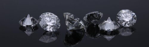 Loose diamonds on black background